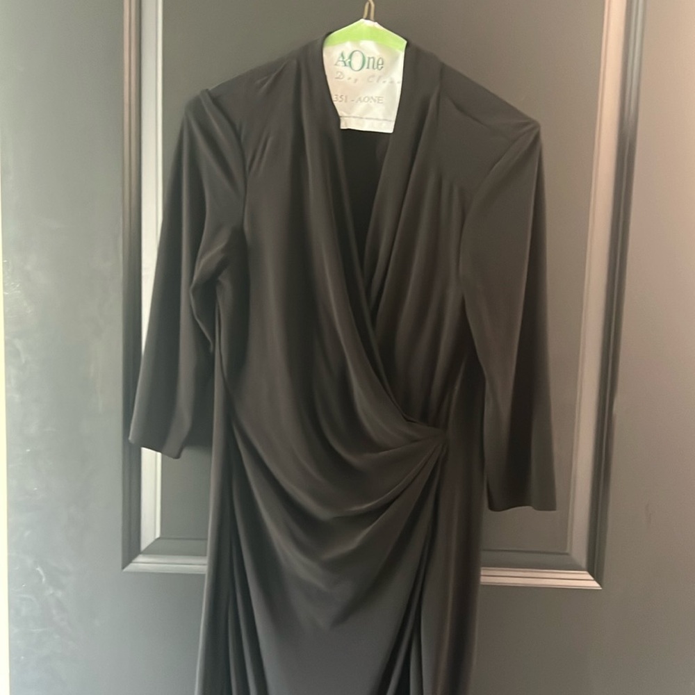 Simple Black faux wrap dress. Stretchy material with draping in the front